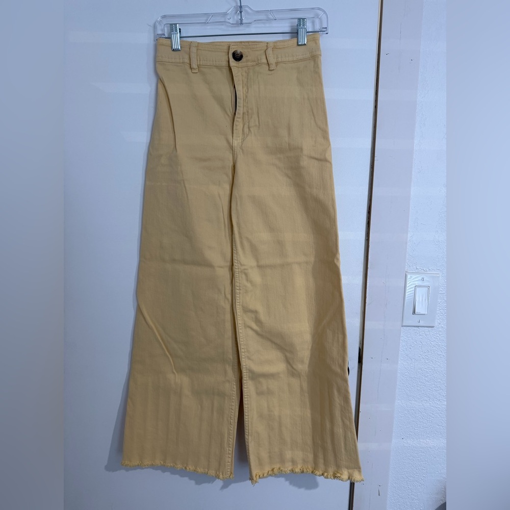 Yellow woman’s high waisted size 27 western short bell bottom pants.